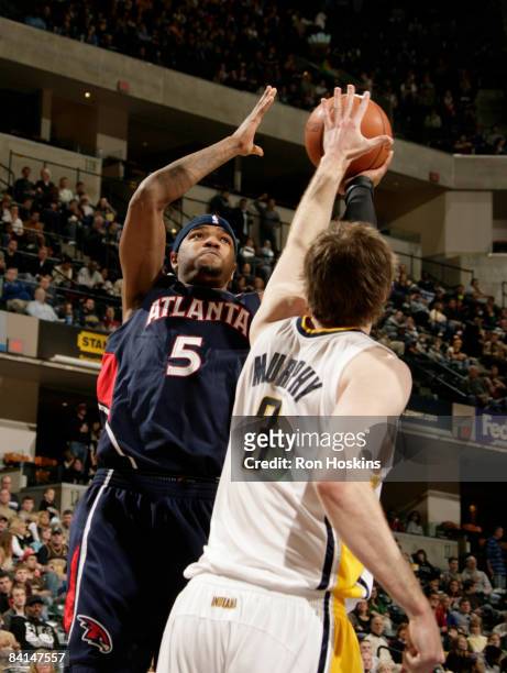 Josh Smith of the Atlanta Hawks shoots over Troy Murphy of the Indiana Pacers at Conseco Fieldhouse on December 30, 2008 in Indianapolis, Indiana....