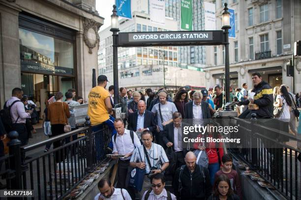 Crowd of pedestrians enter the stairs leading to London Underground metro station at Oxford Circus in central London, U.K., on Thursday, Aug. 31,...