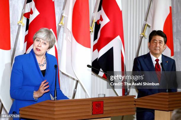 British Prime Minister Theresa May and Japanese Prime Minister Shinzo Abe attend a joint press conference at Akasaka State Guesthouse on August 31,...