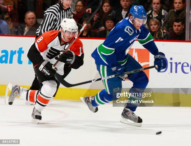 Mike Richards of the Philadelphia Flyers chases down Ryan Kesler of the Vancouver Canucks during their game at General Motors Place on December 30,...