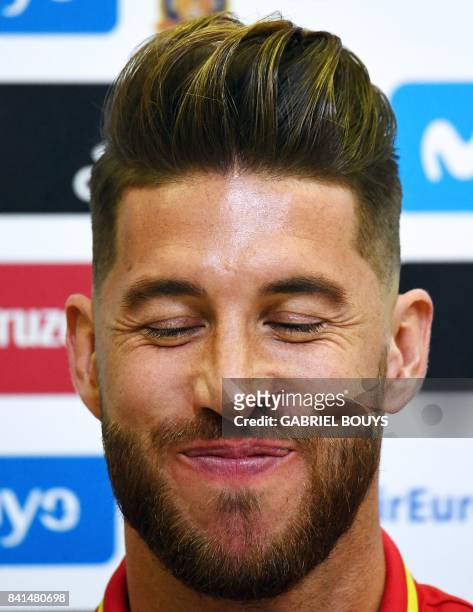 Spain's defender Sergio Ramos smiles during a press conference at the Royal Spanish Football Federation's "Ciudad del Futbol" in Madrid on September...