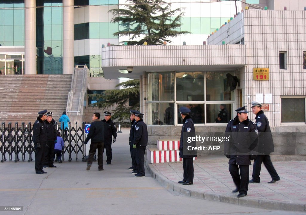 Chinese police surround a court building