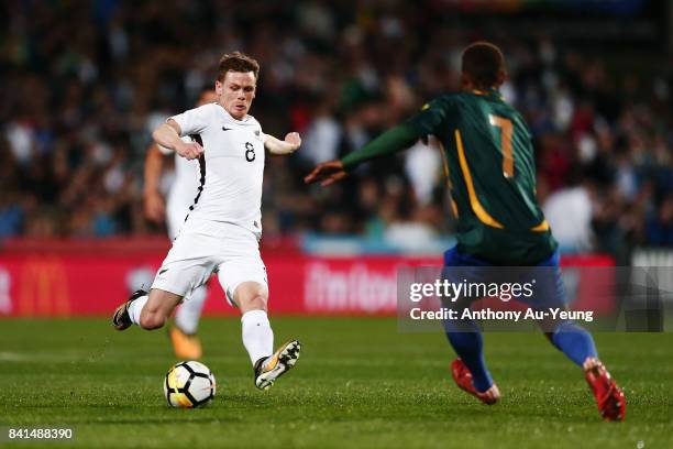 Michael McGlinchey of New Zealand challenges for the ball against Jerry Donga of Solomon Islands during the 2018 FIFA World Cup Qualifier match...