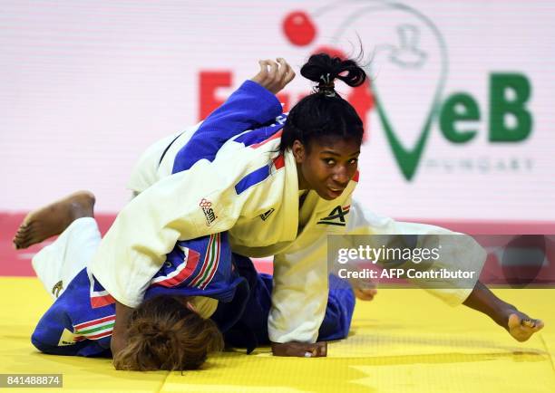 France's Marie Eve Gahie competes with Hungary's Szabina Gercsak during their match in the womens -70kg category at the World Judo Championships in...