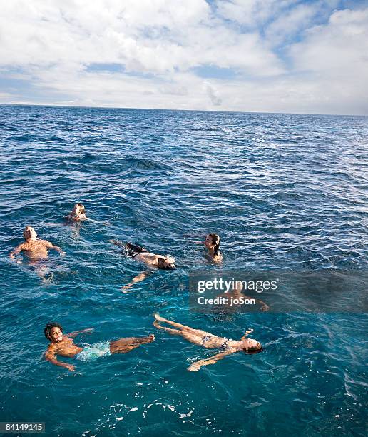 freinds swimming in ocean, at sea - waist deep in water stock pictures, royalty-free photos & images