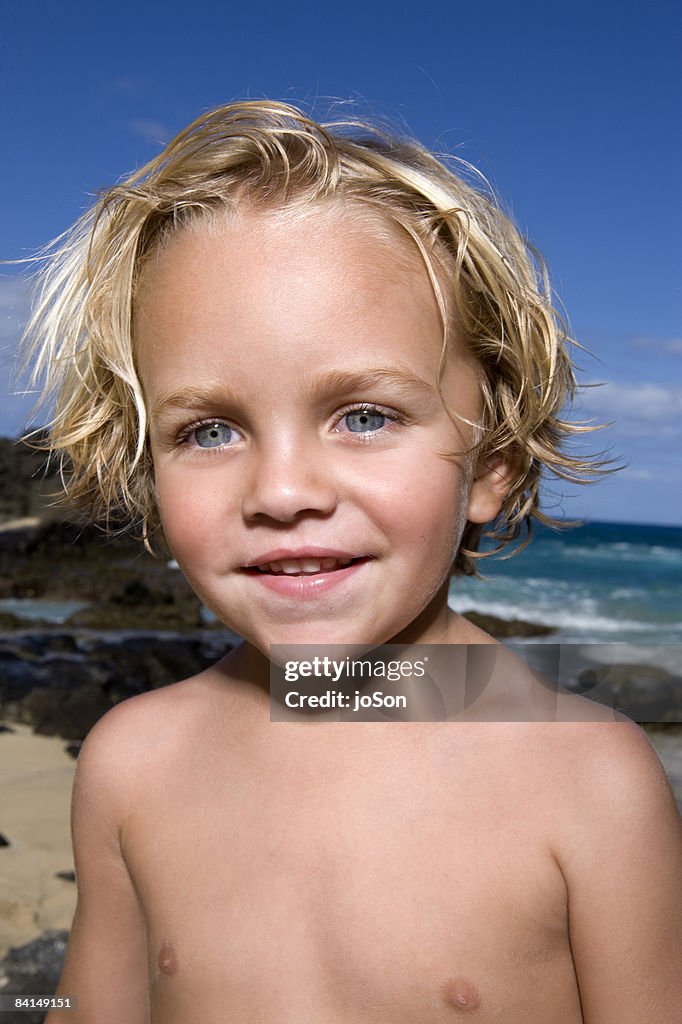 Young boy on beach, close up