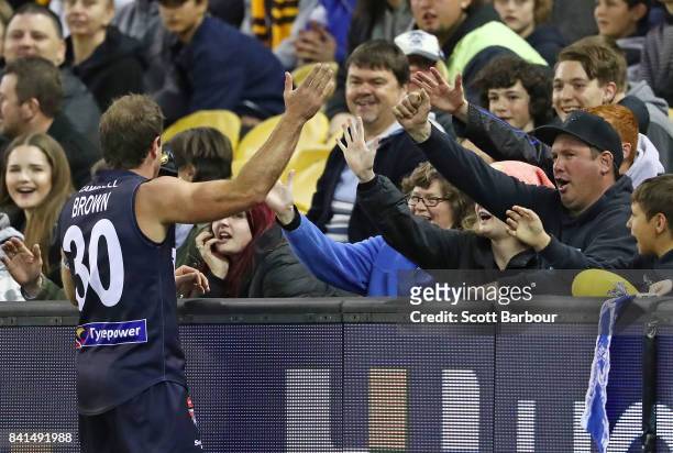 Campbell Brown of Victoria celebrates with supporters in the crowd after kicking a goal during the 2017 EJ Whitten Legends Game between Victoria and...