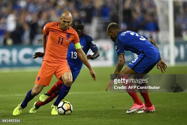 Netherlands' forward Arjen Robben vies with France's midfielder N'Golo Kante and France's defender Layvin Kurzawa during the 2018 FIFA World Cup...