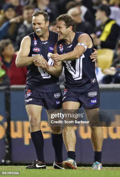 Campbell Brown of Victoria celebrates with Brad Johnson of Victoria after kicking a goal during the 2017 EJ Whitten Legends Game between Victoria and...