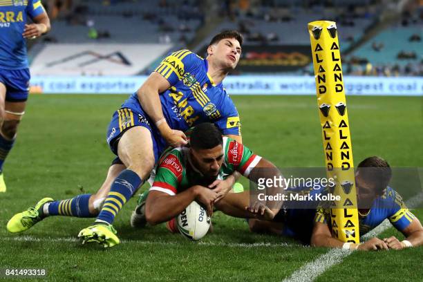 Robert Jennings of the Rabbitohs scores a try during the round 26 NRL match between the Parramatta Eels and the South Sydney Rabbitohs at ANZ Stadium...