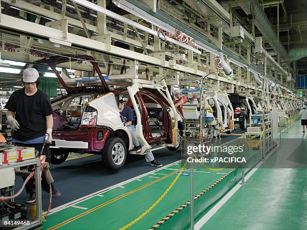 the assembly line at the toyota prius factory. - toyota stock pictures, royalty-free photos & images