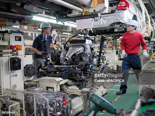 the assembly line at the toyota prius factory. - aichi prefecture stock pictures, royalty-free photos & images