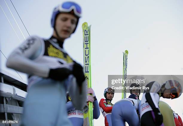 Ski jumpers prepare on the tower during the FIS Ski Jumping World Cup at the 57th Four Hills Ski Jumping Tournament on December 31, 2008 in...