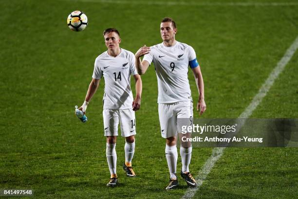 Chris Wood and Ryan Thomas of New Zealand walk off the field after the 2018 FIFA World Cup Qualifier match between the New Zealand All Whites and...