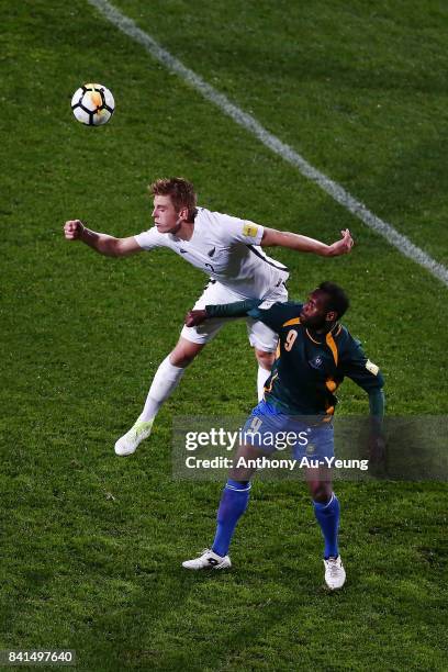 Sam Brotherton of New Zealand goes for a header against Benjamin Totori of Solomon Islands during the 2018 FIFA World Cup Qualifier match between the...