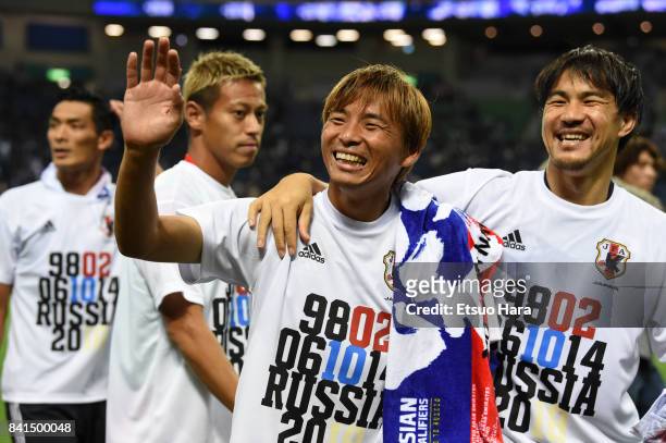 Japanese players celebrate their 2-0 victory and qualification for the FIFA World Cup Russia after their FIFA World Cup Qualifier match between Japan...
