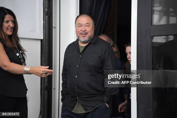 Chinese artist and producer Ai Weiwei attends the photocall of the movie "Human Flow" presented in competition at the 74th Venice Film Festival on...