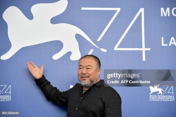 Chinese artist and producer Ai Weiwei attends the photocall of the movie "Human Flow" presented in competition at the 74th Venice Film Festival on...