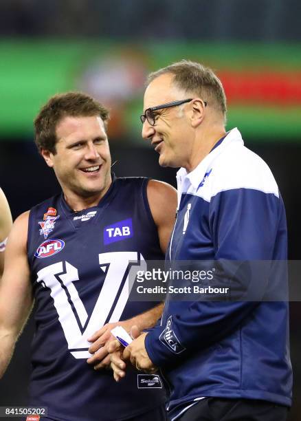 Campbell Brown of Victoria speaks with Tim Watson,coach of Victoria during the 2017 EJ Whitten Legends Game between Victoria and the All Stars at...