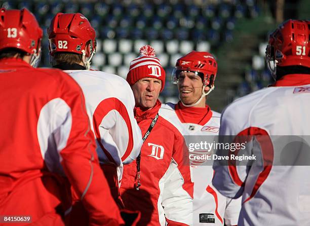 Coach Mike Babcock of the Detroit Red Wings speaks with players during practice a day before playing against the Chicago Blackhawks in the NHL Winter...