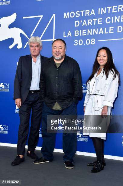 Christopher Doyle, Ai Weiwei and guest attend the 'Human Flow' photocall during the 74th Venice Film Festival on September 1, 2017 in Venice, Italy.