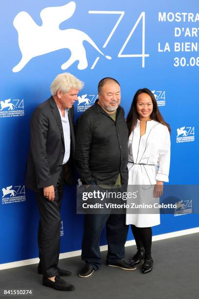 Christopher Doyle, Ai Weiwei and guest attend the 'Human Flow' photocall during the 74th Venice Film Festival on September 1, 2017 in Venice, Italy.