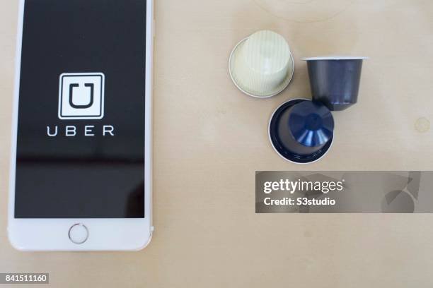 The startup screen of Uber, car transportation mobile app developed by the American technology company Uber Technologies Inc, pictured on the display...