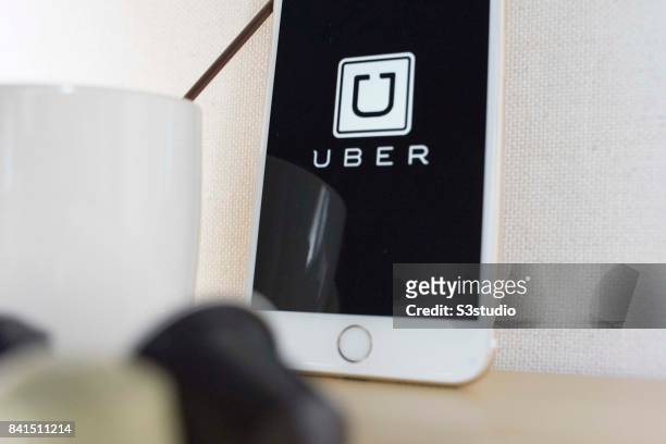 The startup screen of Uber, car transportation mobile app developed by the American technology company Uber Technologies Inc, pictured on the display...