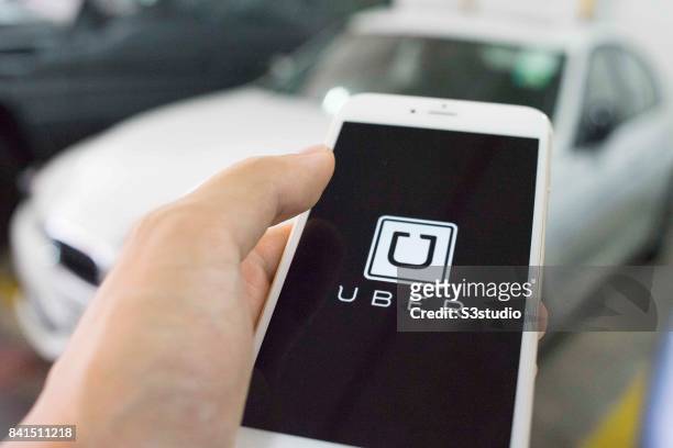 The startup screen of Uber, car transportation mobile app developed by the American technology company Uber Technologies Inc, pictured on the display...