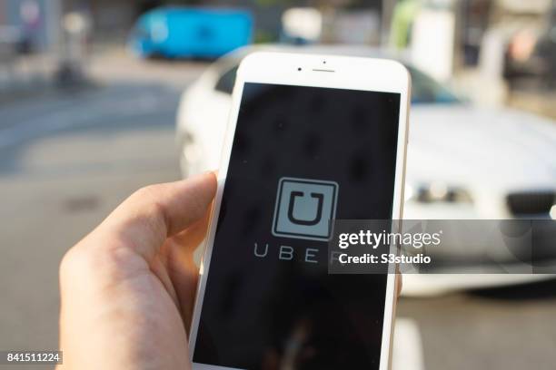 The startup screen of Uber, car transportation mobile app developed by the American technology company Uber Technologies Inc, pictured on the display...