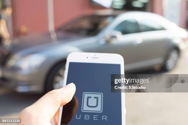 The startup screen of Uber, car transportation mobile app developed by the American technology company Uber Technologies Inc, pictured on the display...