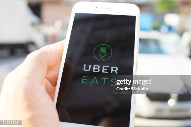 The startup screen of UberEATS, a food delivery mobile app developed by the American technology company Uber Technologies Inc, pictured on the...