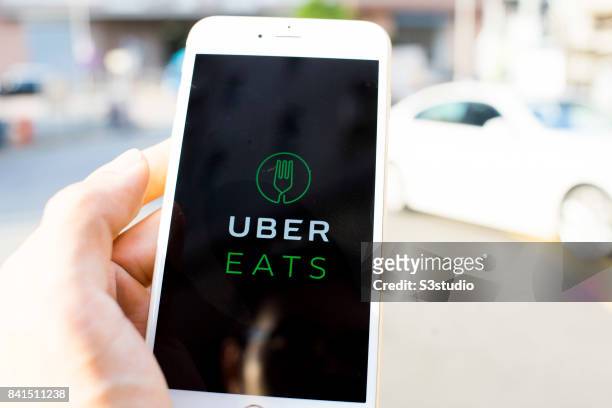 The startup screen of UberEATS, a food delivery mobile app developed by the American technology company Uber Technologies Inc, pictured on the...
