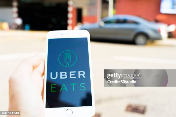 The startup screen of UberEATS, a food delivery mobile app developed by the American technology company Uber Technologies Inc, pictured on the...