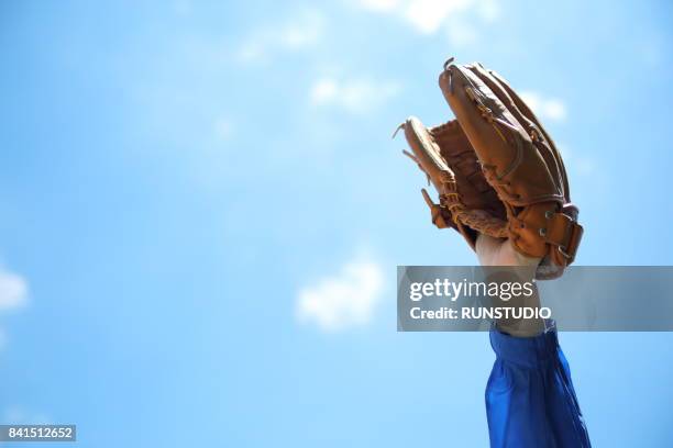 close up of male hand wearing baseball glove - catchers mitt stock pictures, royalty-free photos & images