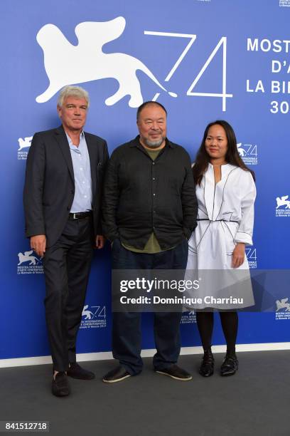 Christopher Doyle, Ai Weiwei and guest attend the 'Human Flow' photocall during the 74th Venice Film Festival on September 1, 2017 in Venice, Italy.