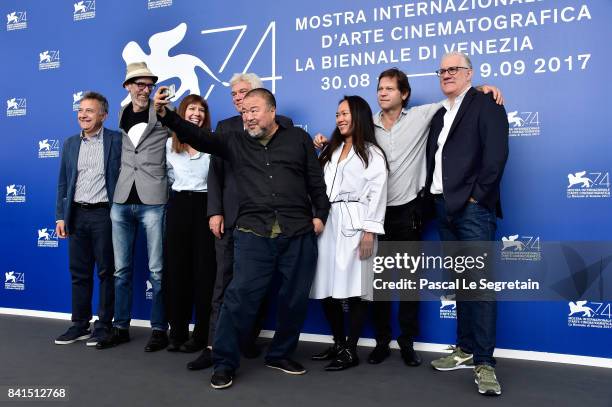 Paolo Del Brocco, Niels Pagh Andersen, Diane Weyermann, Christopher Doyle, Ai Weiwei and guests attend the 'Human Flow' photocall during the 74th...