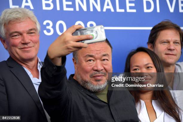 Christopher Doyle, Ai Weiwei and guests attend the 'Human Flow' photocall during the 74th Venice Film Festival on September 1, 2017 in Venice, Italy.