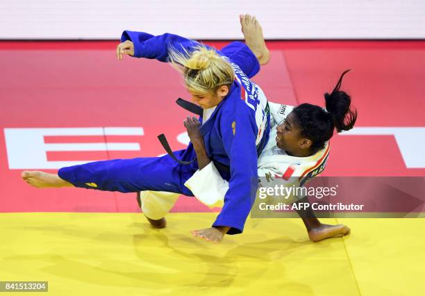 France's Marie Eve Gahie competes with Aleksandra Samardzic during their match in the womens -70kg category at the World Judo Championships in...