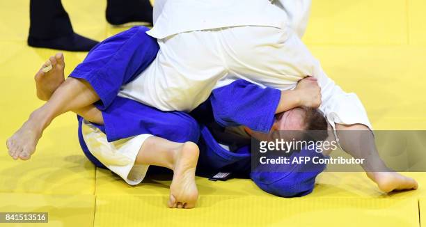 Japan's Chizuru Arai competes with Slovenia's Anka Pogacnik during their match in the womens -70kg category at the World Judo Championships in...