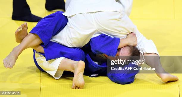 Japan's Chizuru Arai competes with Slovenia's Anka Pogacnik during their match in the womens -70kg category at the World Judo Championships in...
