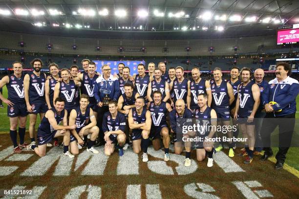 Victoria pose with the trophy after winning the 2017 EJ Whitten Legends Game between Victoria and the All Stars at Etihad Stadium on September 1,...