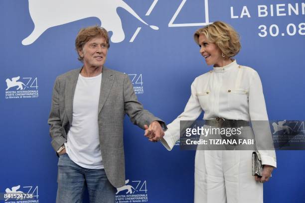 Actors Jane Fonda and Robert Redford attend a photocall during the 74th Venice Film Festival on September 1, 2017 at Venice Lido. - Jane Fonda and...