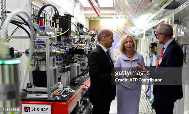 German Education and Research Minister Johanna Wanka chats with Mayor of Hamburg Olaf Scholz and European XFEL Managing Director Robert Feidenhans'l...