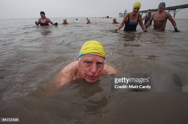 Members of the Middle Yeo Surf Lifesaving Club laugh as they take part in their annual charity New Years Day swim in the Bristol Channel on January 1...