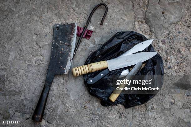 Set of knives used to slaughter a sacrificial sheep are seen on the ground during Eid-al-Adha celebrations on September 01, 2017 in Kilis, Turkey,...