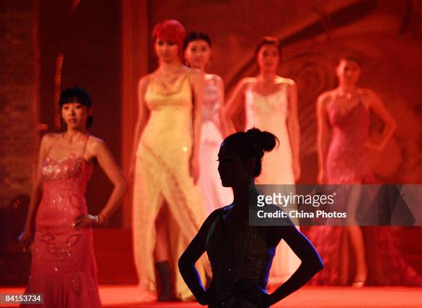 Models showcase designs on the catwalk during a fashion show on December 31, 2008 in Nanjing of Jiangsu Province, China. Ever since the first fashion...