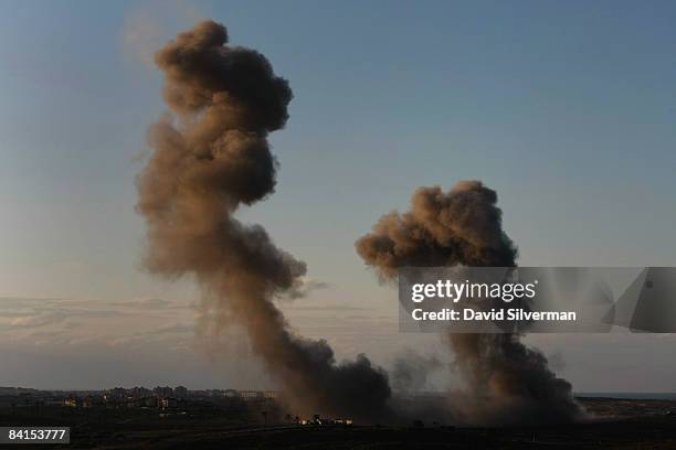 Huge columns of smoke and debris rises after Israeli Air Force bombs exploded on Palestinian targets in the northern Gaza Strip January 1, 2009 as...