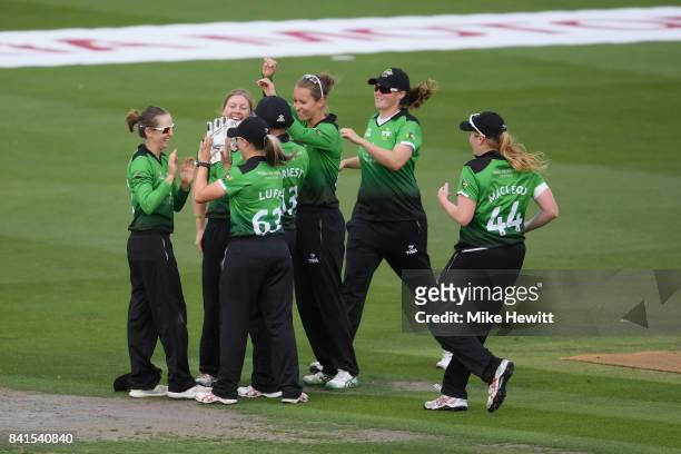 Heather Knight of Western Storm celebrates with Fran Wilson of Western Storm after Wilson took the catch to dismiss Natalie Sciver of Surrey Stars...