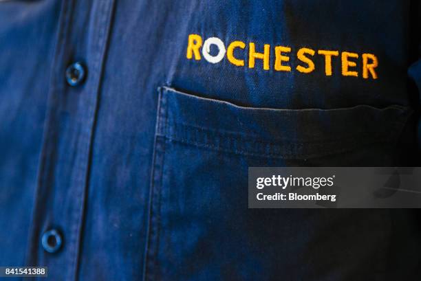 Logo sits on the work shirt of an employee at a Rochester furniture store, operated by Steinhoff International Holdings NV, in Johannesburg, South...